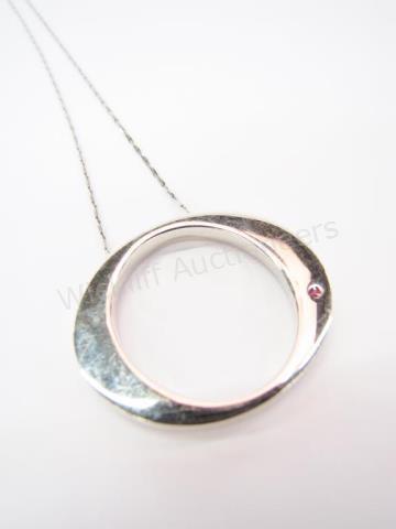 Appraisal: An K white gold Roberto Coin circle pendant with signature