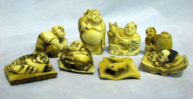 Appraisal: Eight various Japanese netsukes in carved ivory with stained finish