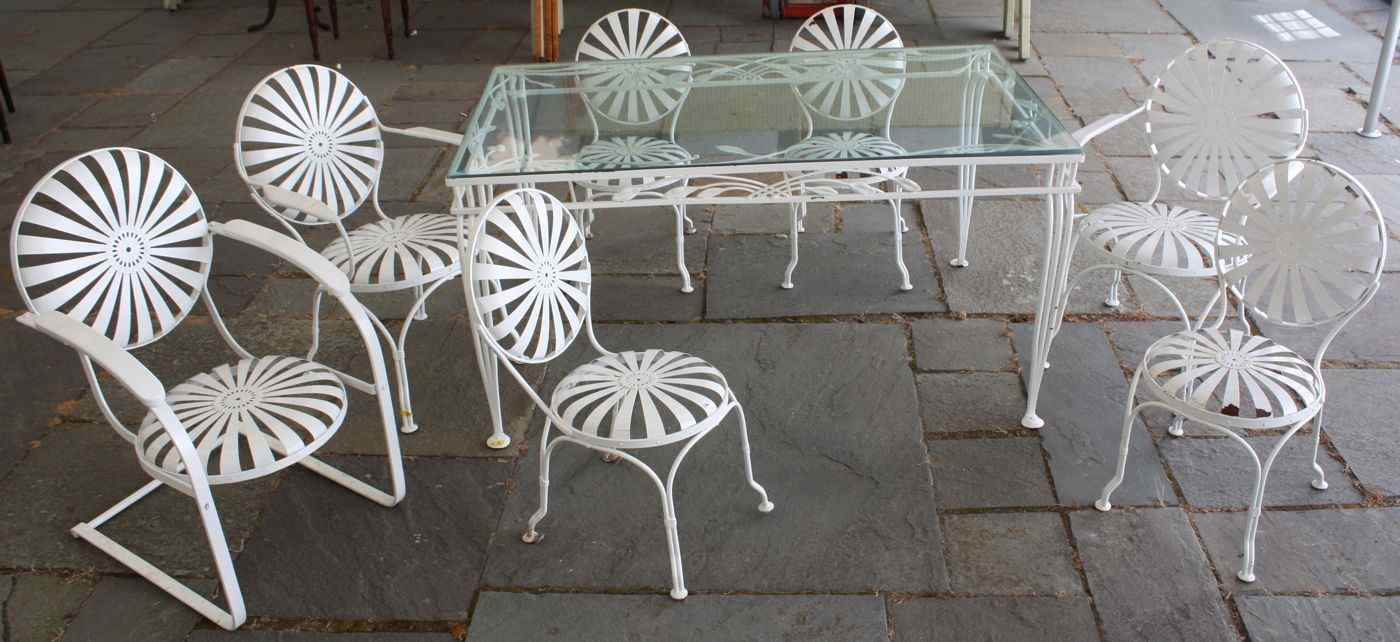 Appraisal: EIGHT-PIECE PATIO DINING SETIn white-painted iron Two armchairs four side