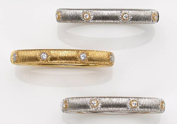 Appraisal: each of hinged design the textured gold bangles with eight