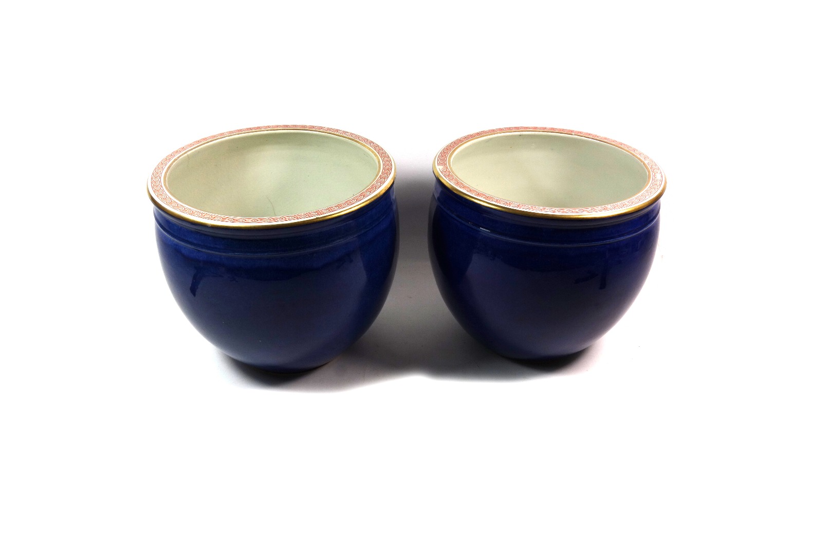 Appraisal: A pair of Booths powder blue glazed circular jardinieres in