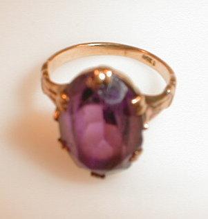 Appraisal: A purple paste set in yellow metal ring stamped ct