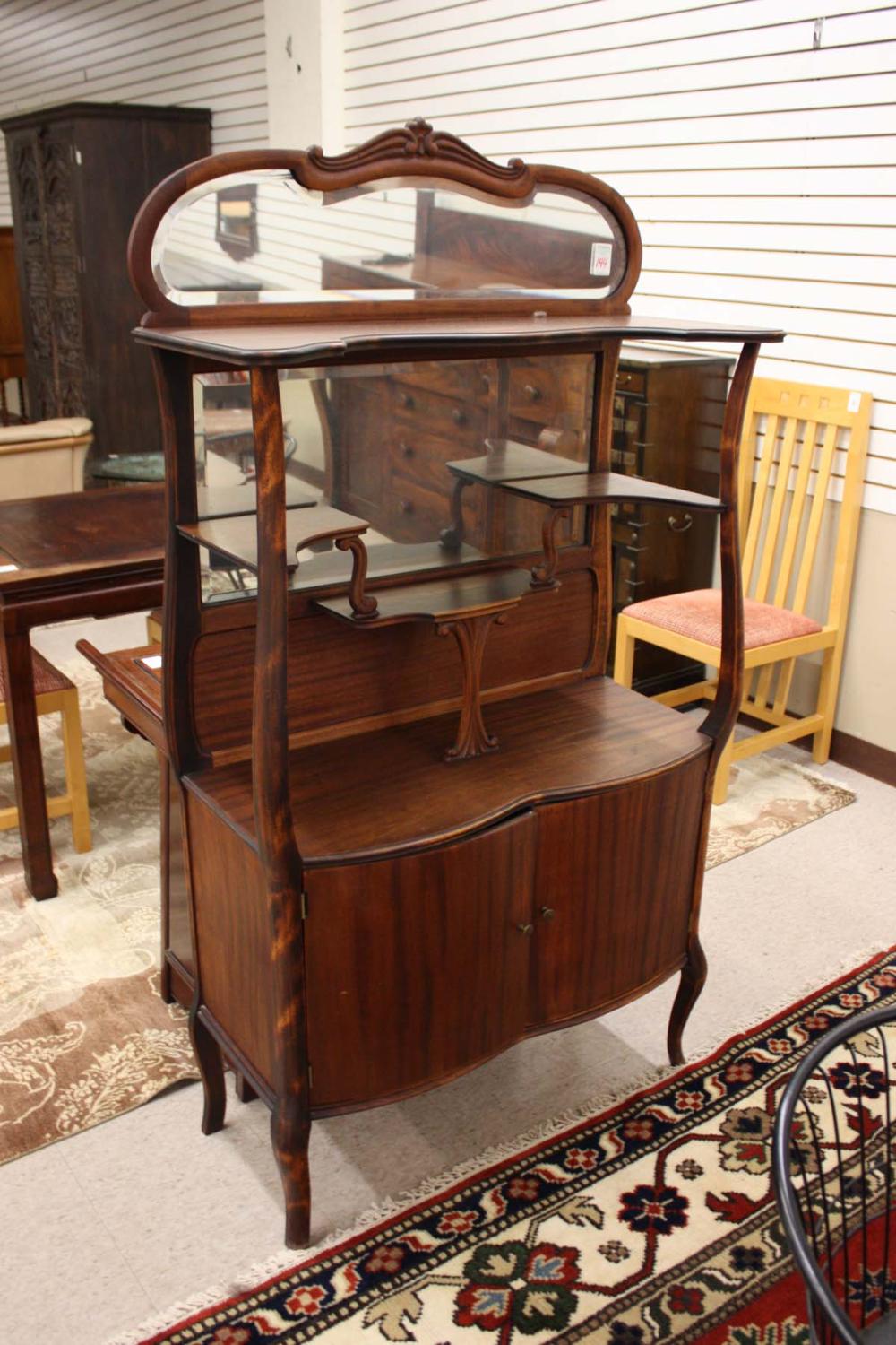 Appraisal: LATE VICTORIAN MAHOGANY ETAGERE American c featuring a mirror-panel crest