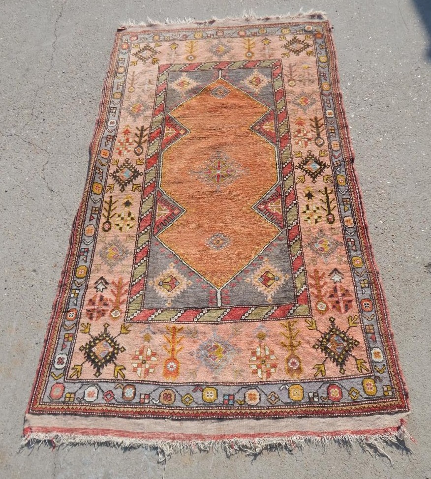 Appraisal: A Kazak type rug with a geometric design of medallions