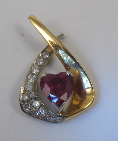 Appraisal: RUBY AND DIAMOND PENDANT k yellow and white gold set