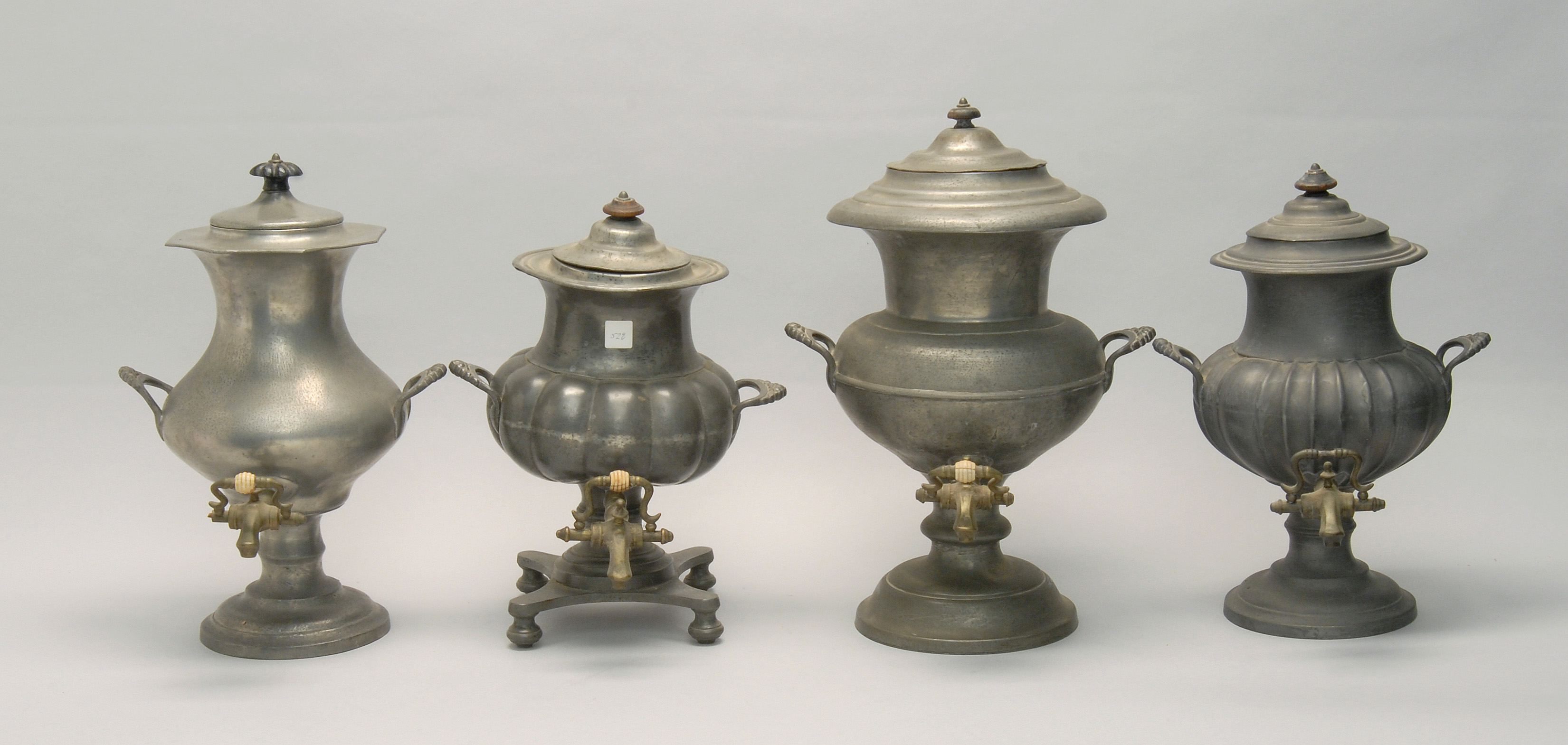 Appraisal: FOUR TH CENTURY PEWTER COFFEE URNS Heights from to ConditionPatinaed