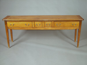 Appraisal: A cherrywood side table th century the top above two