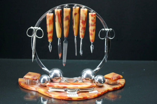 Appraisal: An Art Deco manicure set in chrome and tortoiseshell plastic