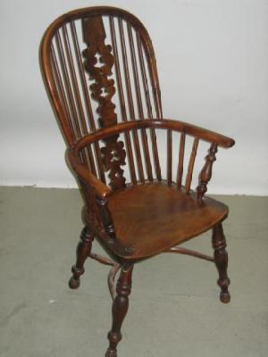 Appraisal: A NORTH COUNTRY YEW WINDSOR ARM CHAIR of high hoop