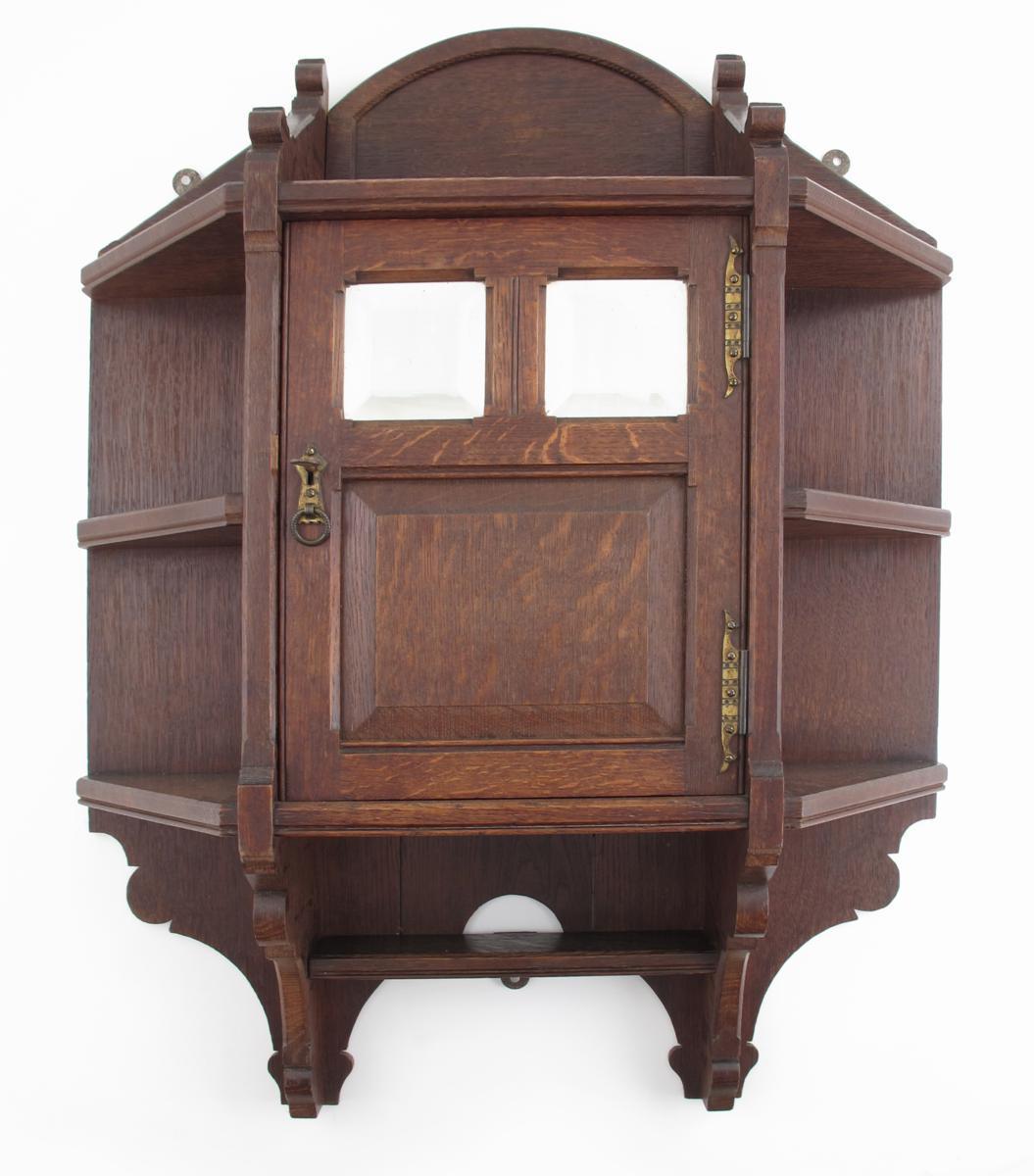 Appraisal: A Gothic Revival oak hanging wall cabinet