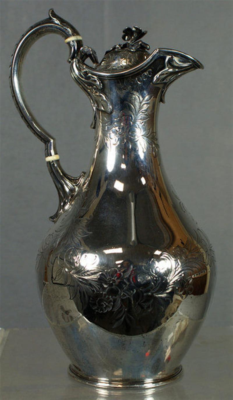 Appraisal: English Victorian wine ewer engraved floral design lily finial London