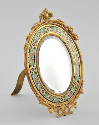 Appraisal: An Ormolu Vanity Mirror with Champleve Decoration Oval beveled mirror