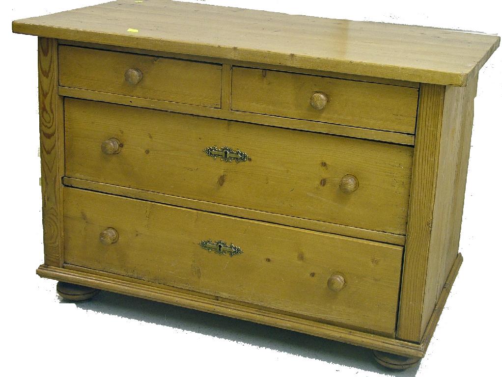 Appraisal: Stripped pine low chest of drawers with two short over