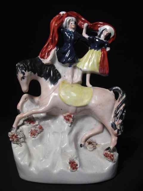 Appraisal: th century Staffordshire figural group depicting two women on the