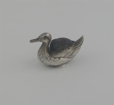 Appraisal: A swimming duck with textured plumage by Crisford Norris Birmingham