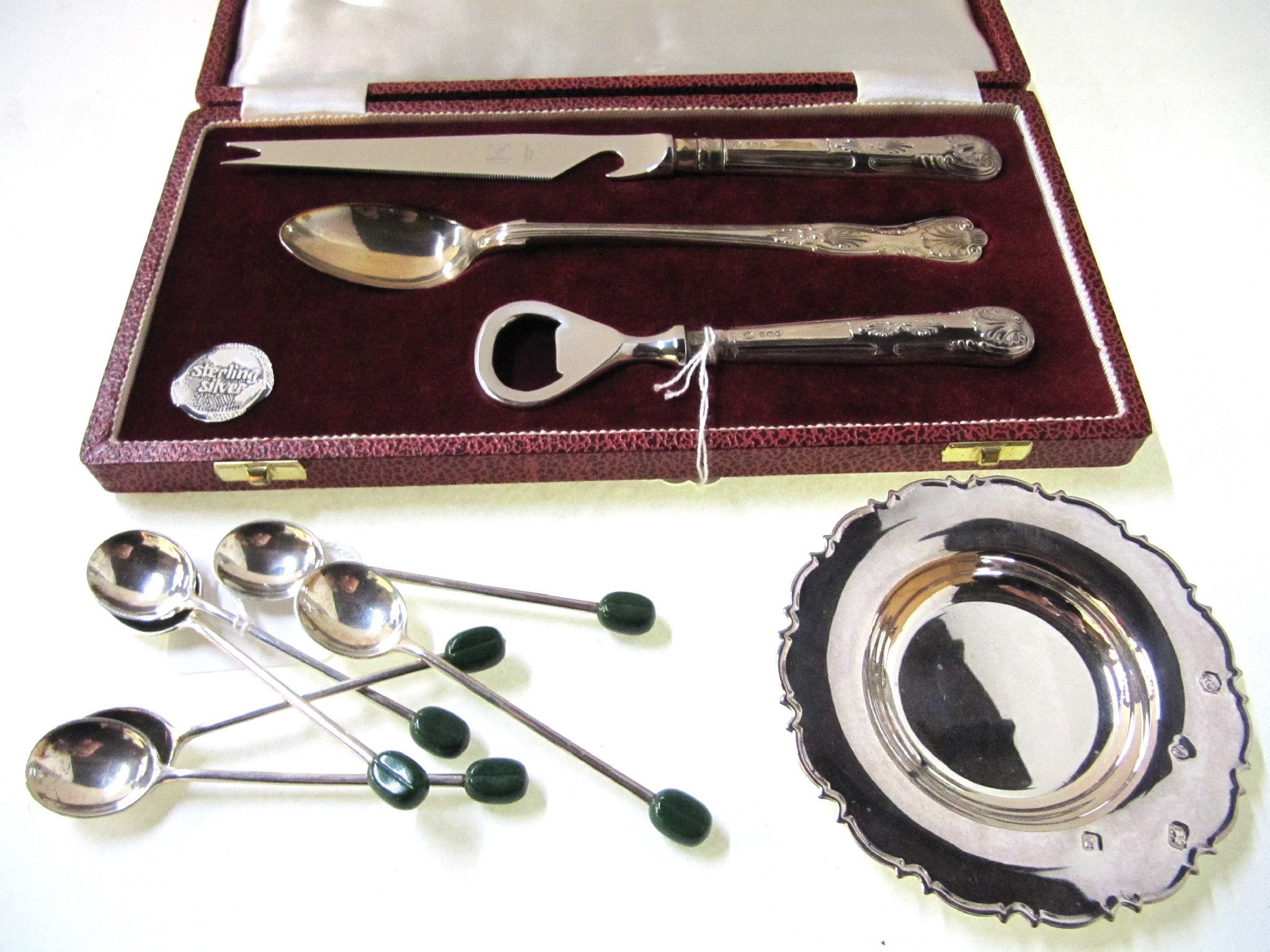 Appraisal: A lot comprising a cased three piece silver cocktail cutlery