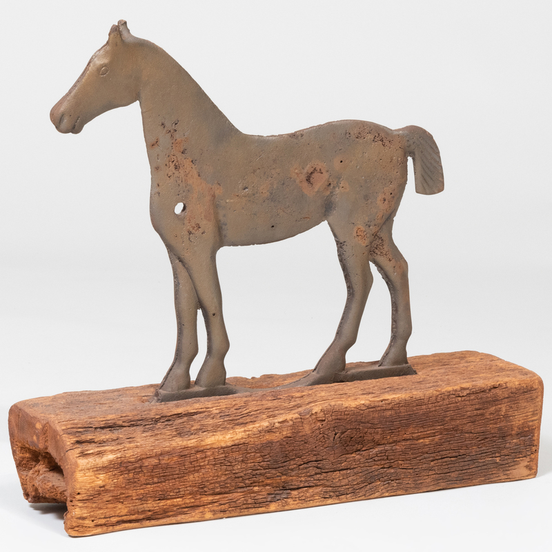 Appraisal: Cast-Iron Horse On a later rustic wooden block base x