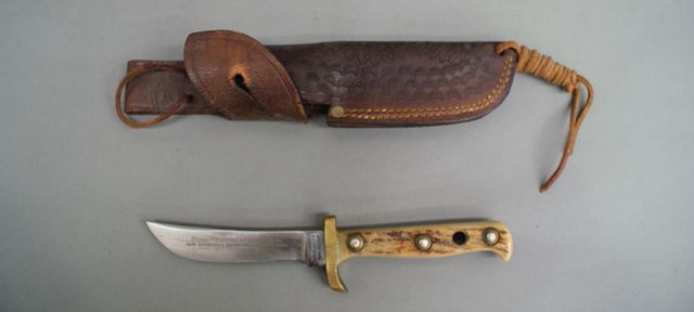 Appraisal: A Puma trapper's companion inch blade marked stag scales complete