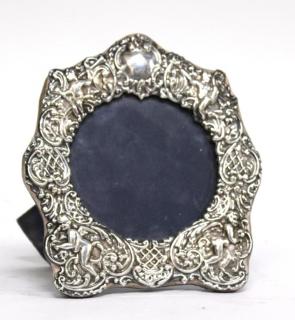 Appraisal: English Sterling Silver Picture Frame Of cartouche form with repousse