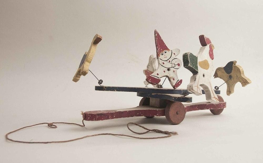 Appraisal: Vintage Wood Toys A painted vintage wood cannon toy on