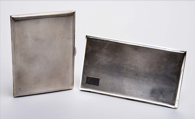 Appraisal: A SILVER CIGARETTE CASE WITH ENGINE TURNED DECORATION approximately gms