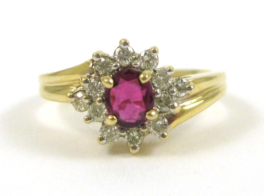 Appraisal: RUBY DIAMOND AND FOURTEEN KARAT GOLD RING with twelve round-cut