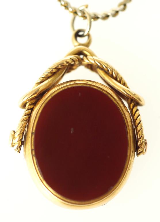 Appraisal: VICTORIAN ct GOLD CORNELIAN AND BLOODSTONE SET SWIVELLING LOCKET of