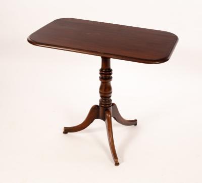 Appraisal: A th Century rectangular mahogany table raised on a turned