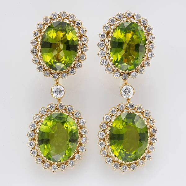 Appraisal: A pair of peridot diamond and eighteen karat gold earrings