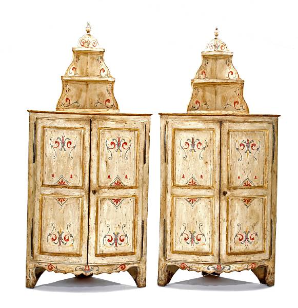 Appraisal: A pair of Continental Rococo paint decorated polychrome corner cabinets