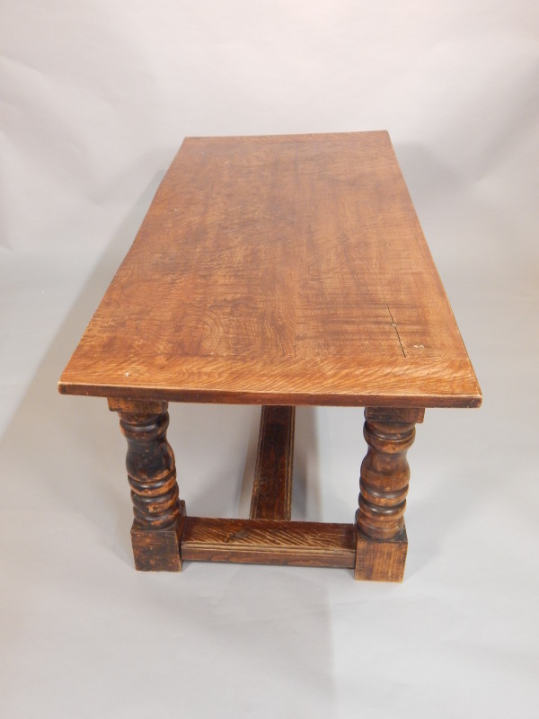 Appraisal: A modern refectory table with stained elm top on turned