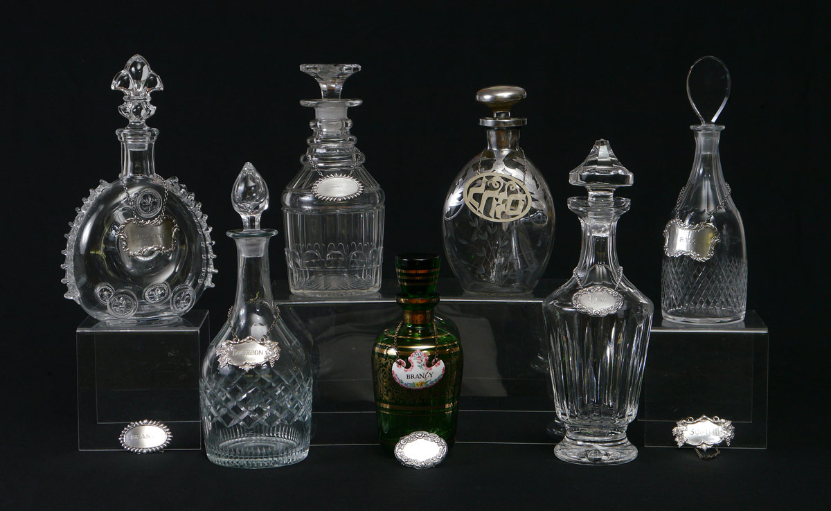 Appraisal: DECANTERS INCLUDING BACCARAT PLAQUES assorted decanters to include Baccarat ''Remy