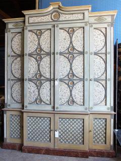 Appraisal: Moderne polychrome and green painted breakfront cabinet having a molded