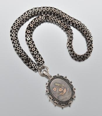 Appraisal: An English Silver Locket and Chain Sterling silver locket decorated