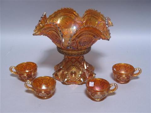 Appraisal: FIVE PIECES OF ORANGE CARNIVAL GLASS Including a ruffled edge