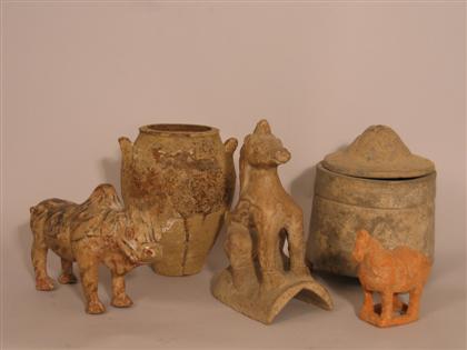 Appraisal: Five Chinese pottery items Comprised of an animal form tile