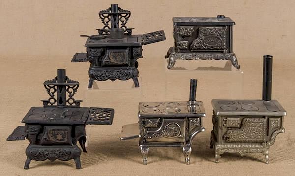 Appraisal: Five cast iron and nickel toy stoves to include Five