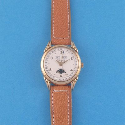 Appraisal: A complicated wristwatch by Garrard automatic movement and the dial