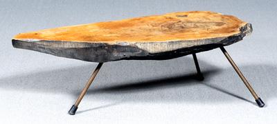 Appraisal: Karl Aubock coffee table naturalistic figured walnut slab mounted with