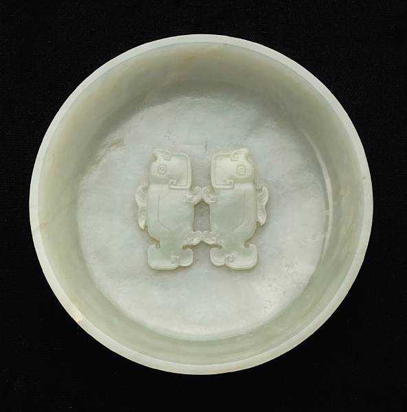 Appraisal: A white jade twin-fish dish Qianlong Mark and Period Its