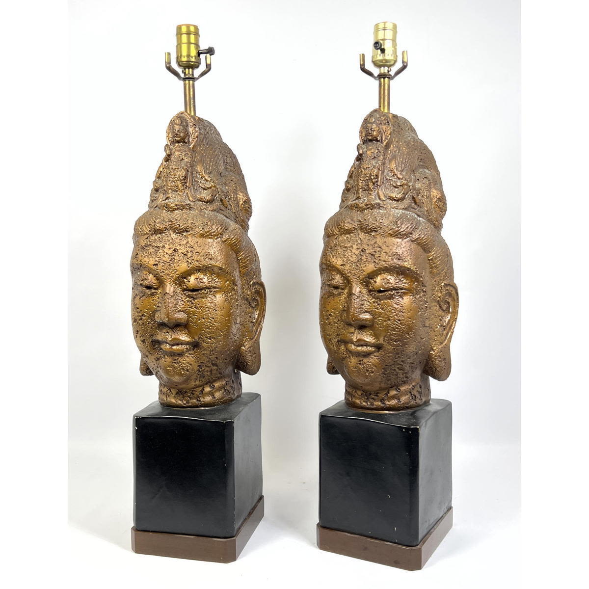 Appraisal: Pr Asian Figural Head Table Lamps Plaster on Black and