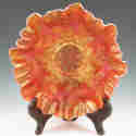 Appraisal: Carnival glass ruffled bowl with leaves and berries Unmarked Couple