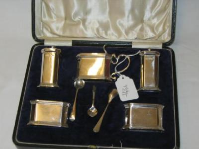 Appraisal: A MATCHED FIVE PIECE CONDIMENT SET of canted oblong form