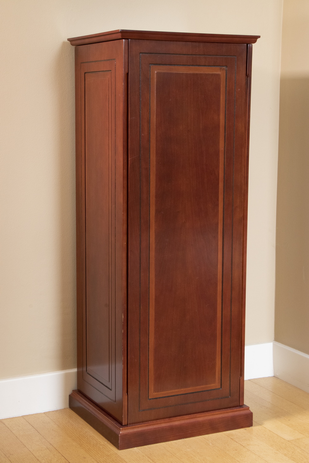 Appraisal: VERTICAL WOODEN MEDIA CABINET A dark finished wooden CD cabinet