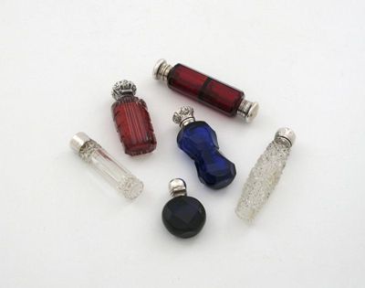 Appraisal: A collection of silver mounted scent bottles comprising a Victorian