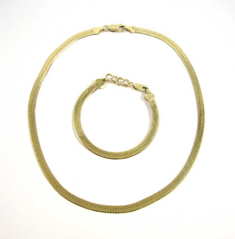 Appraisal: FOURTEEN KARAT GOLD CHAIN NECKLACE AND BRACELET SET both herringbone