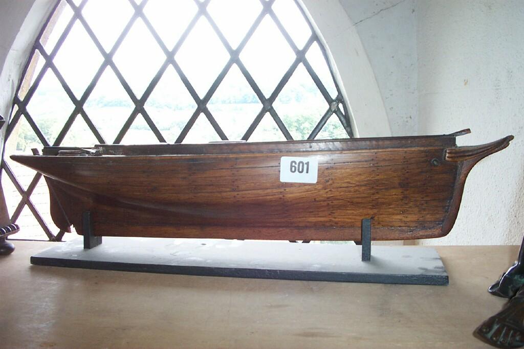 Appraisal: A th century wooden model boat with planked hull together