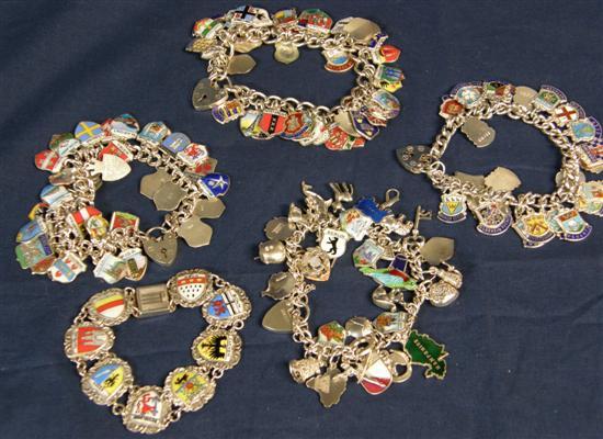 Appraisal: Five white metal bracelets with silver and enamelled city and