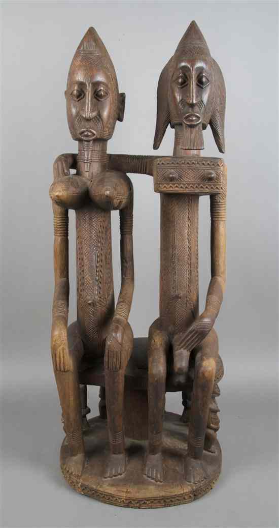 Appraisal: A Carved Wood Figural Group Dogon depicting a seated male