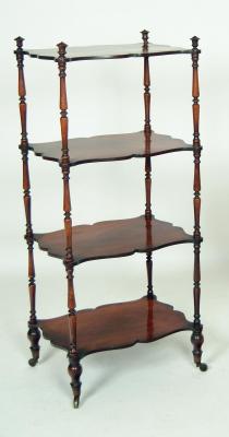 Appraisal: A VICTORIAN WALNUT FOUR TIER WHATNOT of serpentine oblong form